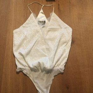 Parallel Lines white leopard print bodysuit with lace edged wrap styling NWOT